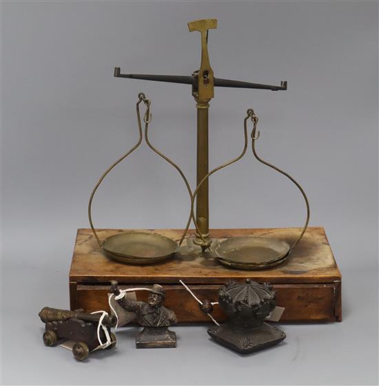 A set of scales, a bronze crown, a bronze bust of a toper, a bronze and wood cannon and a quantity of medallions
